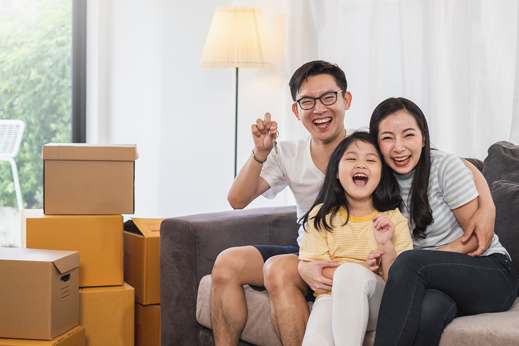 Happy Family Holding House Key